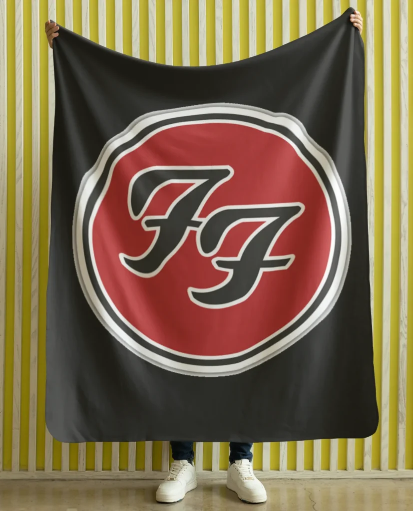 man holding flannel blanket featuring design from rock band foo fighters on sale at the foo fighters merch store