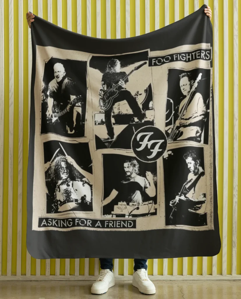 man holding flannel blanket featuring design from rock band foo fighters on sale at the foo fighters merch store