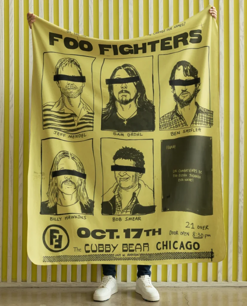 man holding flannel blanket featuring design from rock band foo fighters authentic 2026