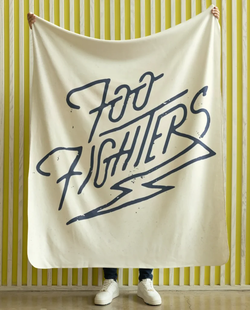 man holding flannel blanket featuring design from rock band foo fighters authentic 2026
