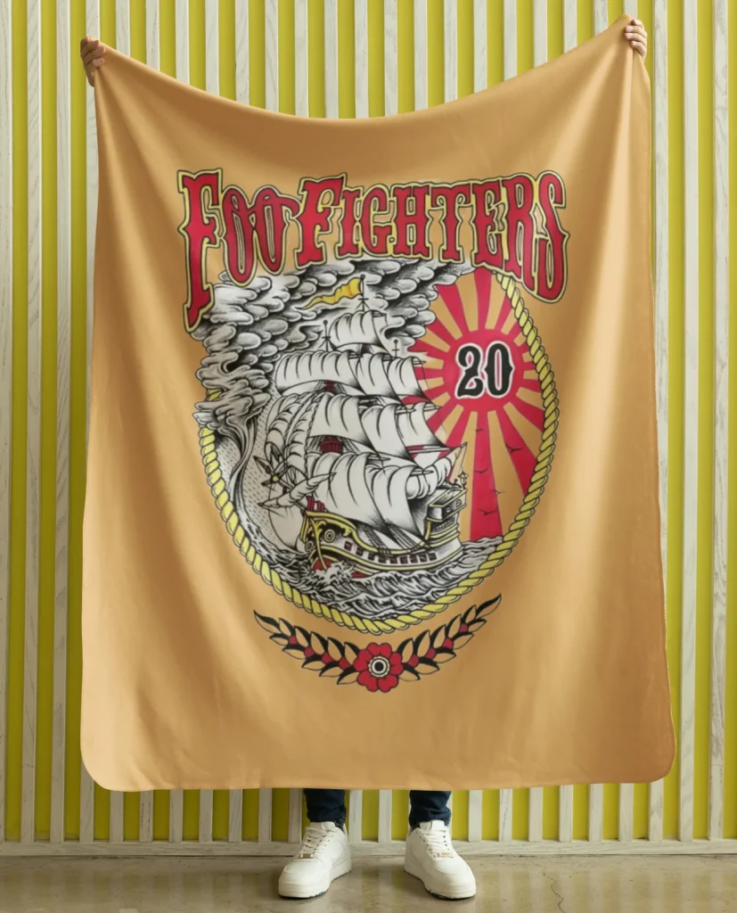 man holding flannel blanket featuring design from rock band foo fighters on sale at the foo fighters merch store